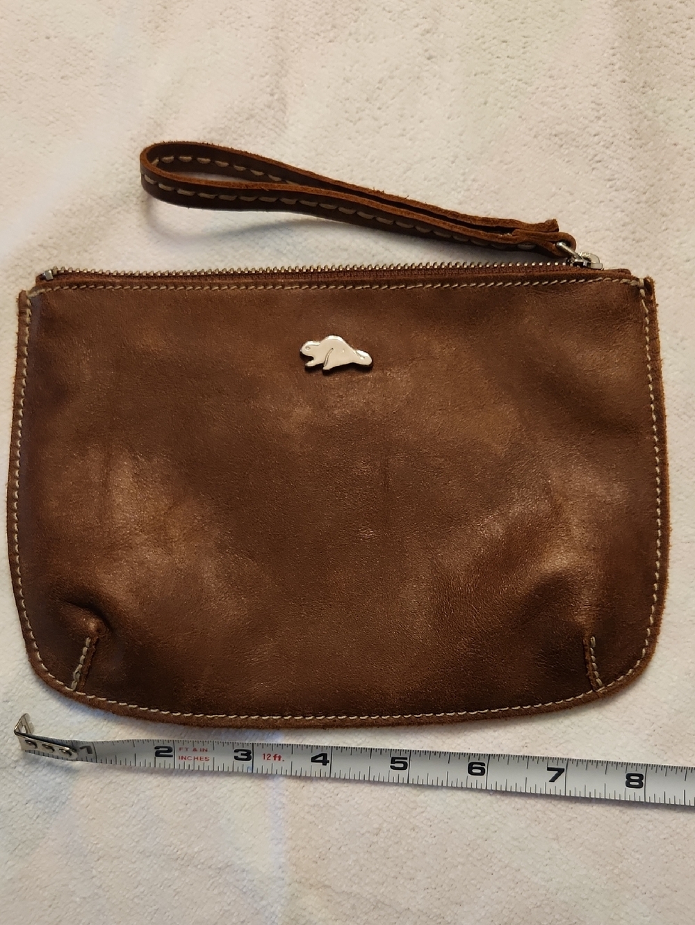 Roots brown leather wristlet